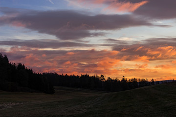 Landscape with colorful sunrise clouds