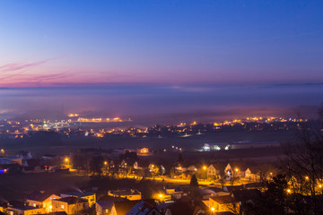 Fog near the city after sunset