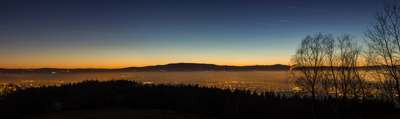 Colorful sunset above czech city Budweis panorama