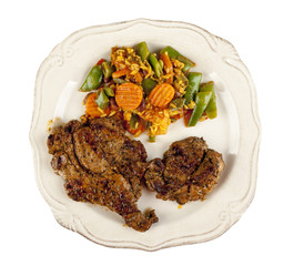 Grilled meat and vegetables on a plate