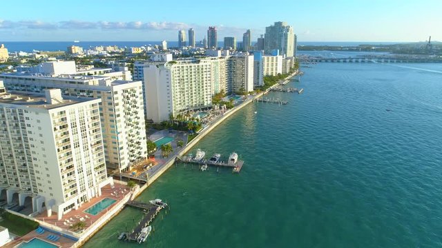 Aerial drone flying past condominiums on the bay 4k 24p