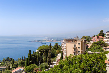 Fototapeta na wymiar Taormina, Sicily. View of the city and the picturesque coast of the Ionian Sea