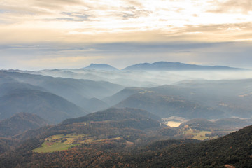 Fototapeta premium The mountains and the fog dream between them on the horizon