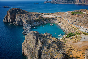 Fototapeta premium View of St. Paul´s bay, Lindos village and Mediterranean Sea from acropolis of Lindos (Rhodes, Greece)