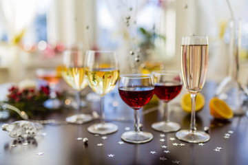 New Year's party. White and red wins and drinks in glasses.
