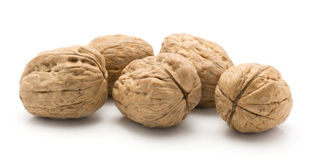 Unshelled walnuts isolated on white background five whole.