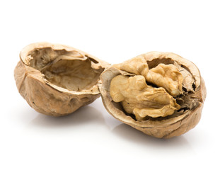 One shelled walnut with separated hollow half isolated on white background.