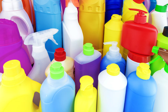 background of multi-colored bottles with household chemicals