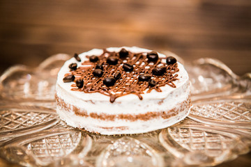 Delicious sweet baked cake with coffee beans.