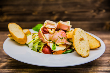 Food on a plate, on a wooden background.Food detail