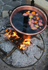 hot MULLED WINE on the big cauldron over the bonfire during the winter break