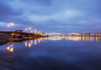 Fototapeta na wymiar Evening Neva overlooking the Maloohtinsky and Bolsheokhtinsky bridges. St. Petersburg. Russia