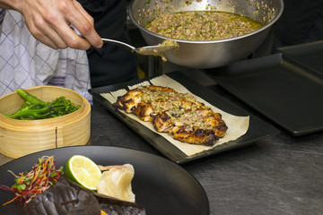 Human hand is preparing steak 