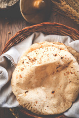 indian bread / Chapati / Fulka / Gehu Roti with wheat grains in background. It's a Healthy fiber rich traditional North/South Indian food, selective focus   © StockImageFactory