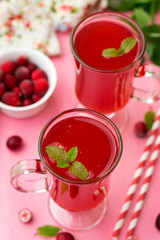 Russian traditional drink kissel with cranberries and mint