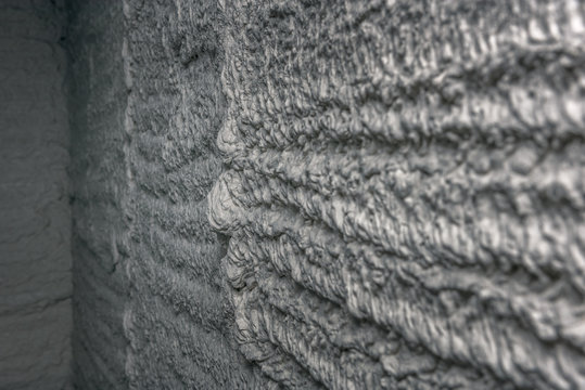 Mortar wall texture. with a pluster pump on the construction applied mortar wall. Concept: texture