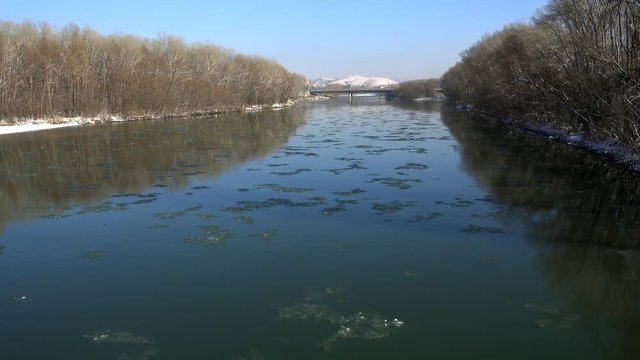 Frozen slabs of ice floating along the river. Ulba River, Ust-Kamenogorsk. Kazakhstan. Full HD 1080p footage
