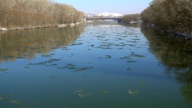 Frozen slabs of ice floating along the river. Ulba River, Ust-Kamenogorsk. Kazakhstan. Full HD 1080p footage
