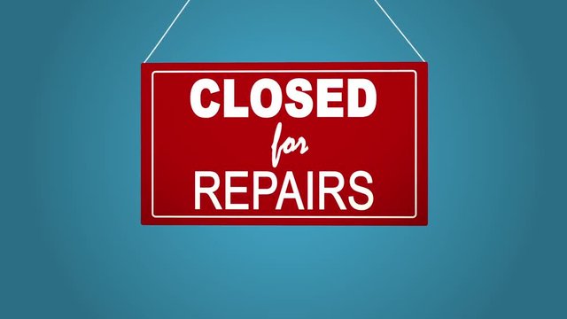 A business sign that says closed for repairs. Blue background