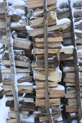 snow-covered firewood store 