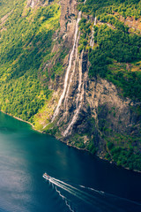 Breathtaking view of Sunnylvsfjorden fjord and famous Seven Sisters waterfalls, near Geiranger village in western Norway.