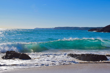Brechende Welle am Strand