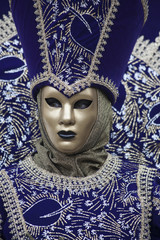 Fototapeta na wymiar Traditional Venice Carnival mask and costume worn at Febuarys festival in Venice Italy