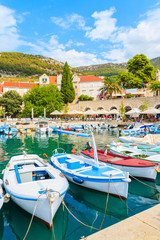Fototapeta na wymiar View of Bol port with fishing boats and colorful houses, Brac island, Croatia