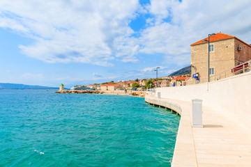 Coastal promenade along sea in Bol port with typical town architecture, Brac island, Croatia