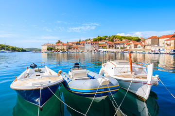 Fototapeta na wymiar Typical fishing boats mooring in Milna port, Brac island, Croatia