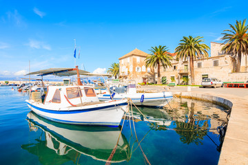 Fototapeta na wymiar Fishing boat anchoring in beautiful Sutivan port, Brac island, Croatia