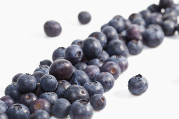 Macro photo of blueberries on white background.  Shallow depth of field.