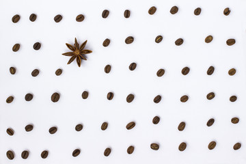 Coffee beans and star anise on white background. Top view