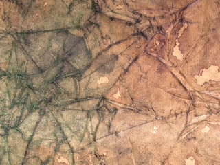 Grunge brown paper background. Wrinkled and stained.