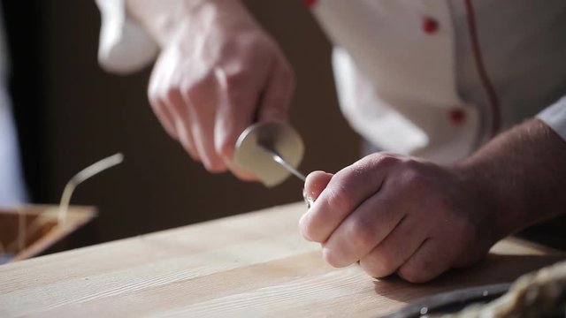 Portrait of the process of opening the shell of an oyster