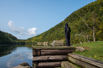 Hiker looking across the lower Cascade lake