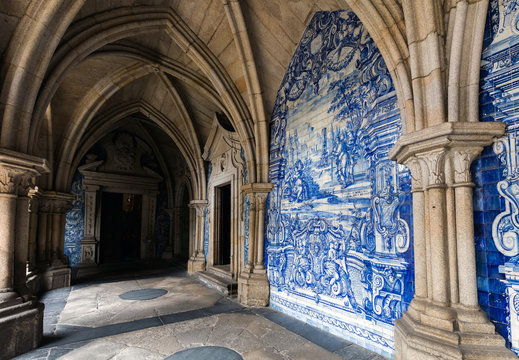 The cloister walls of Porto's Cathedral are decorated with the traditional Portugese blue and white painted tin-glazed ceramic tiles called Azulejos.