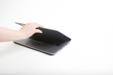 hand with modern notebook computer isolated on white background