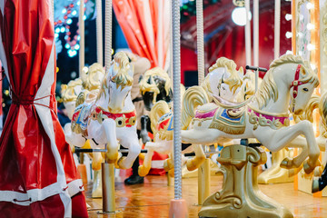 Horses toys on a christmas carnival carousel