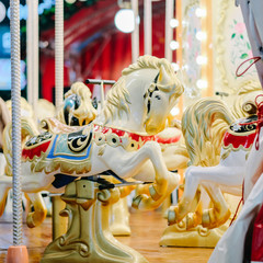 Horses toys on a christmas carnival carousel