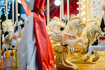 Horses toys on a christmas carnival carousel