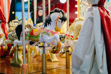 Horses toys on a christmas carnival carousel