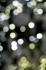 A yellow and white christmas light bokeh background