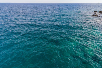 Aerial view on green waves, seabed texture