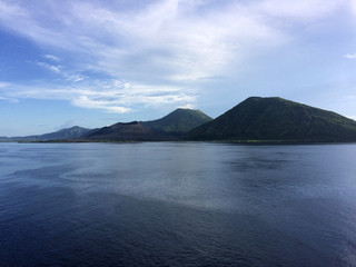 Scene of Simpson Harbour and Rabaul from a cruise ship.