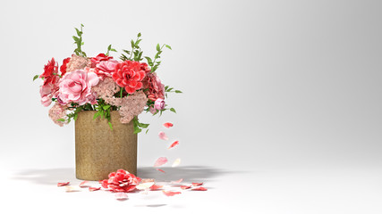Multicolor flowers in wicker basket in front of white background and flowers on the floor