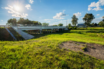 Landscape with bridge sky and sun