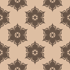 Brown floral seamless design on beige background