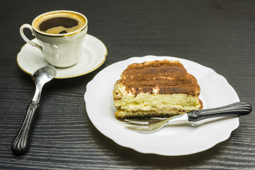 Tiramisu dessert and a cup of coffee.