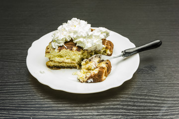 Tiramisu cake with whipped cream.